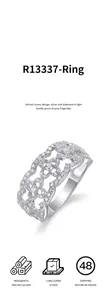 Detail view of the intricate floral openwork pattern on a moissanite 925 silver ring