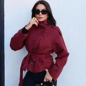 Elegant burgundy short trench coat for women with double-breasted buttons and waist belt
