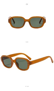 Detail view of fashion oval frame sunglasses in amber showing front and side angles