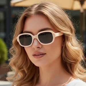 Fashionable beige oval frame sunglasses for women with UV protection for outdoor style