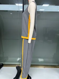 Detailed side view of sleeveless grey and yellow color block wide-leg pants set