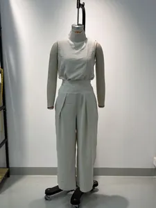 Elegant sleeveless high-neck cotton-linen top and wide-leg pleated trousers set for women