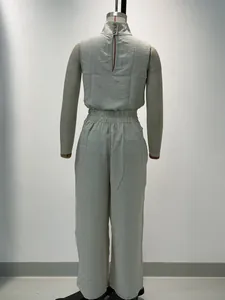 Back view of a solid sage green sleeveless top and wide-leg pants set on a mannequin