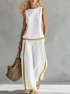 Completo due pezzi con top bianco senza maniche e pantaloni larghi profilati