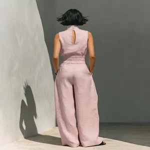 Back view of women's pink linen-blend sleeveless top and wide-leg trousers set