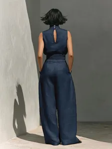 Detail view of navy blue linen sleeveless top and wide-leg trousers set with open back
