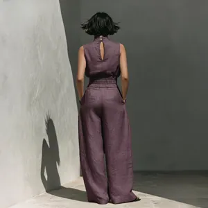 Back view of a purple cotton linen sleeveless top and wide-leg pants resort set