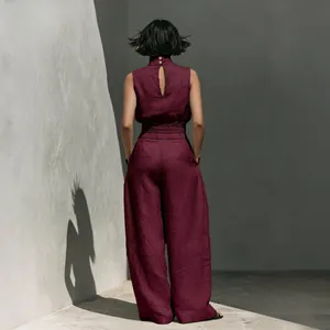 Back view of summer burgundy cotton-linen sleeveless top and wide-leg trousers set.
