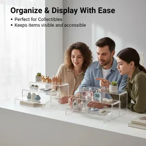 Clear acrylic 3-tier display stand for collectibles in a bright lifestyle setting