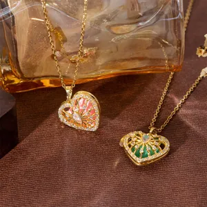 Elegant gold heart locket necklace featuring natural stones and shimmering crystals detail.