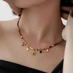 Bohemian Maillard style beaded necklace featuring golden sun and star charms for women
