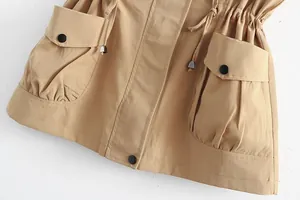 Close-up detail view of khaki casual vest with drawstring waist and large utility pockets
