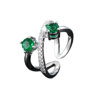Elegant silver criss-cross wrap open ring with green stones and sparkling pavé zircons