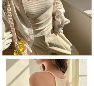 Close-up of the beige ribbed camisole showing knit texture and slim back strap details.
