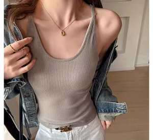 Detailed view of a slim fit ribbed camisole vest in taupe for a minimalist look