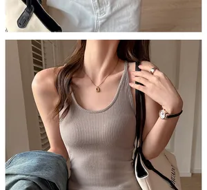 Detailed view of a minimalist women's slim fit ribbed tank top in neutral grey color
