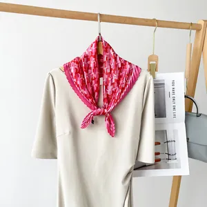 Pleated pink pattern silk neckerchief for women on display