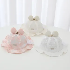 Three baby lace sun hats with floral embroidery and bows in pink, cream, and white.