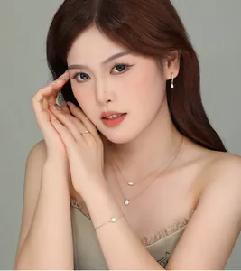 Close-up of S925 sterling silver opal jewelry set on an Asian female model