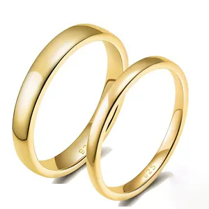 Detailed macro view of S925 sterling silver gold-plated classic plain band rings