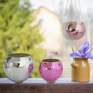 Mirrored disco ball planters in silver and pink for hanging garden decor.
