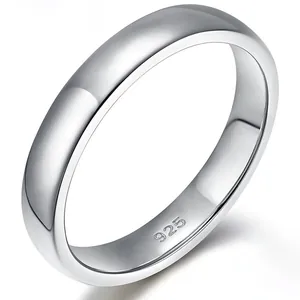 Detailed macro view of a polished 925 sterling silver band ring with inner stamp