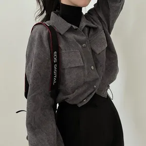 Detail of gray corduroy shirt jacket with drawstring hem and vintage pocket design