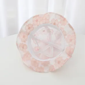 Inside detail of baby floral lace sun hat showing breathable mesh and strap