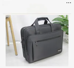 Large capacity black business briefcase made of durable Oxford cloth for laptop use.