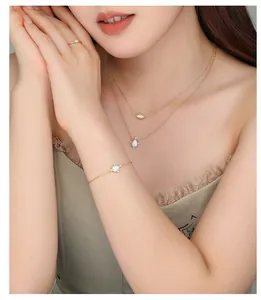 Model wearing s925 silver opal jewelry set with gold plating and cubic zirconia detail