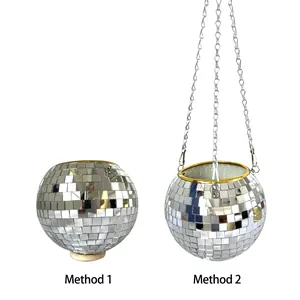 Comparison of disco ball planter display methods: standing and hanging.