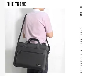 Professional black Oxford briefcase for men being carried by a model