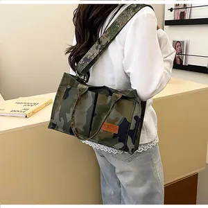 Modern camouflage large capacity tote bag shown being worn as a stylish shoulder bag