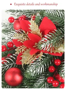 Close-up detail of artificial Christmas wreath with red berries, pine and gold leaves