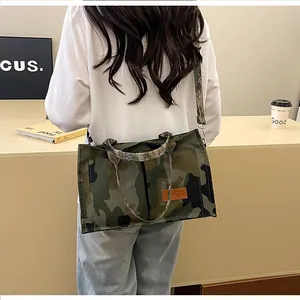 Fashionable large capacity camouflage print tote bag shown being worn as a shoulder bag
