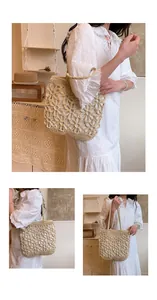 Close-up detail showing the intricate woven hollow-out flower pattern on this large tote bag.
