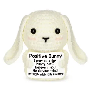 Hand-crocheted white positive bunny doll holding an inspirational quote card gift.