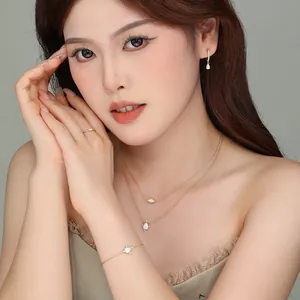 Elegant S925 sterling silver opal necklace and jewelry set worn by a model.