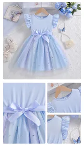 Detail view of light blue ribbed girls dress featuring a bow and star sequin mesh skirt