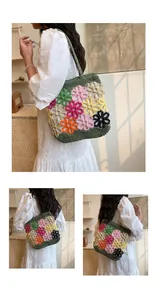 Detailed view of handmade crochet tote bag with colorful floral patterns on model