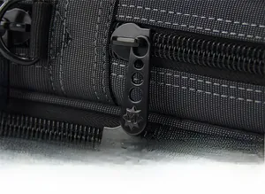 Detail of smooth black metal zipper on durable Oxford cloth business briefcase