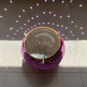 Pink disco ball hanging planter featuring a mirror tile surface and metal hanging chain