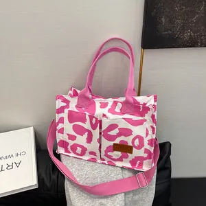 Large capacity pink camo print tote bag with adjustable shoulder strap for daily use