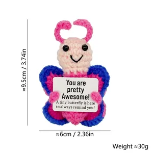 Detailed view of handmade crochet butterfly toy with inspirational message card