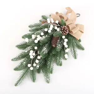 Artificial Christmas pine swag with natural pinecones, white berries and burlap bow