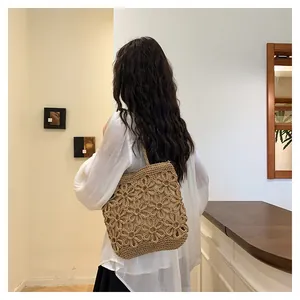 Handcrafted floral hollow woven tote bag in natural khaki for chic summer shopping