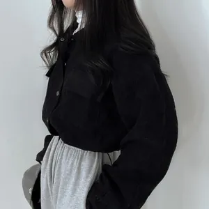 Cropped black corduroy jacket with a loose fit and drawstring hem for chic women
