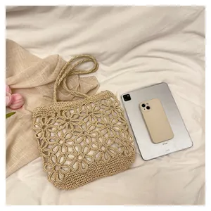 Handwoven hollow flower tote bag shown with iPad and phone for size comparison