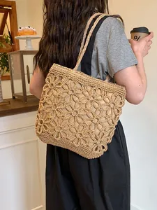 Hand-woven straw tote bag featuring floral hollow-out design and large capacity