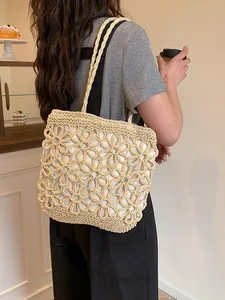Handmade floral hollow woven tote bag for women with large capacity shoulder straps